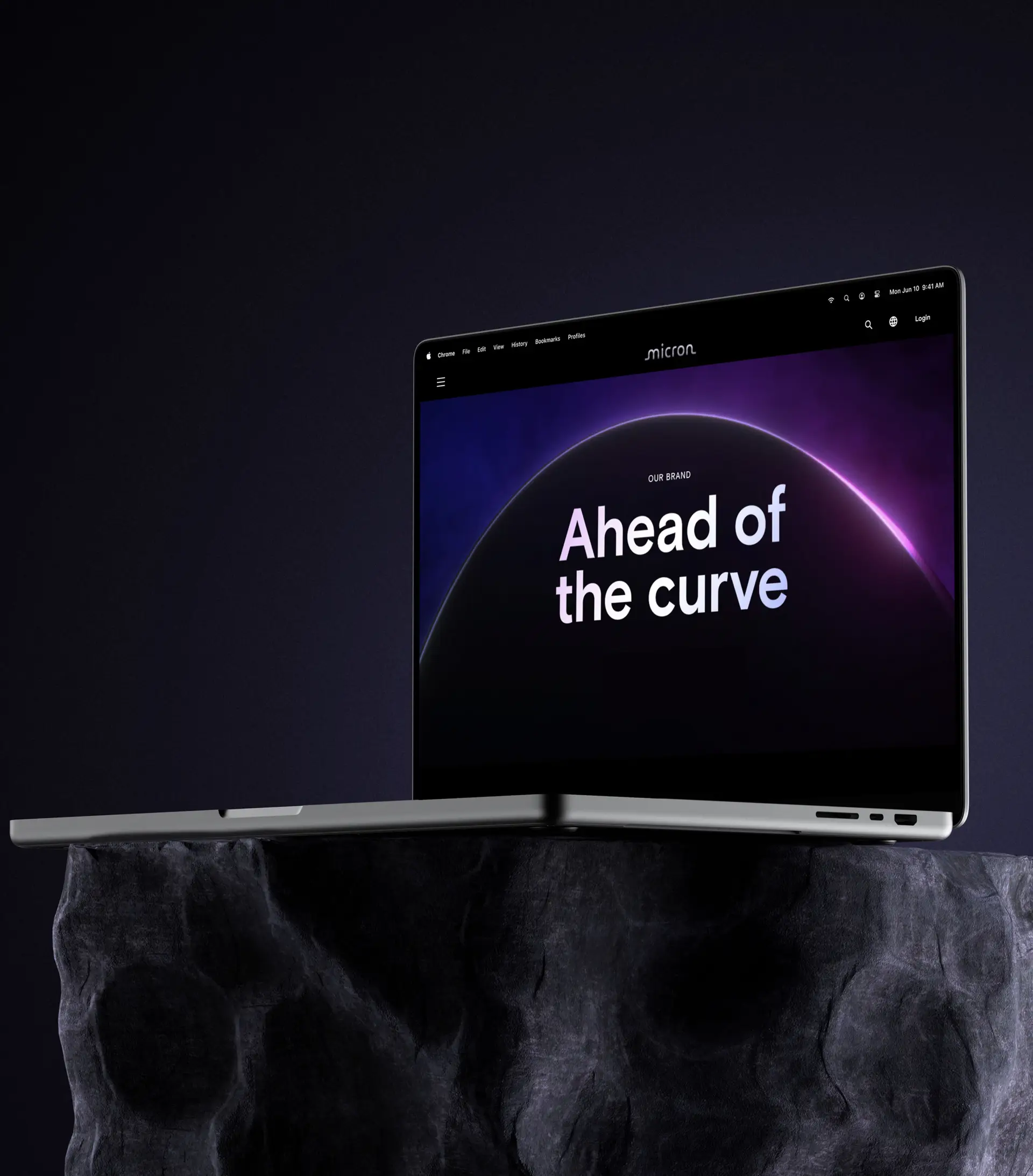 A laptop on a stone plinth displaying the redesigned Micron “Ahead of the curve” brand site