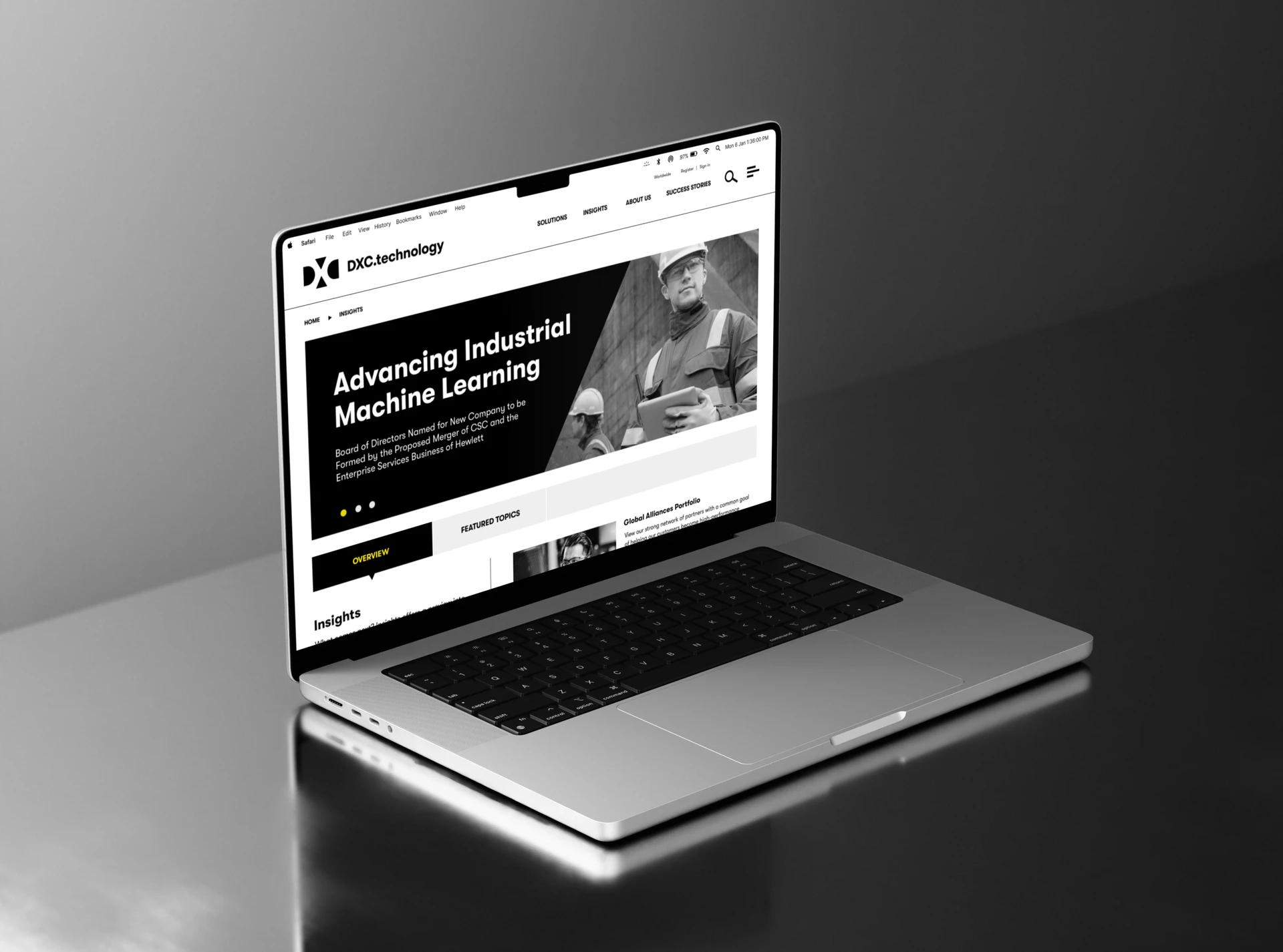 Laptop showing the DXC.technology insights page headlined “Advancing Industrial Machine Learning”