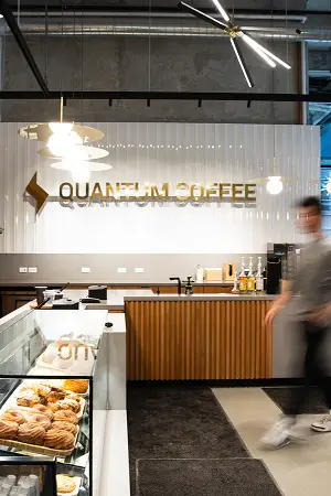 The interior of a Quantum Coffee café with a wood-panelled counter